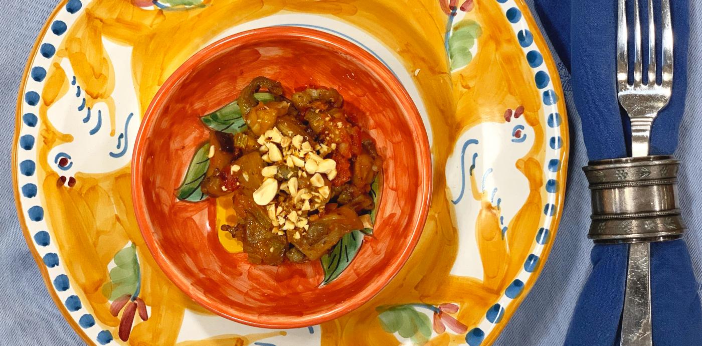 cooked eggplant in a large orange bowl