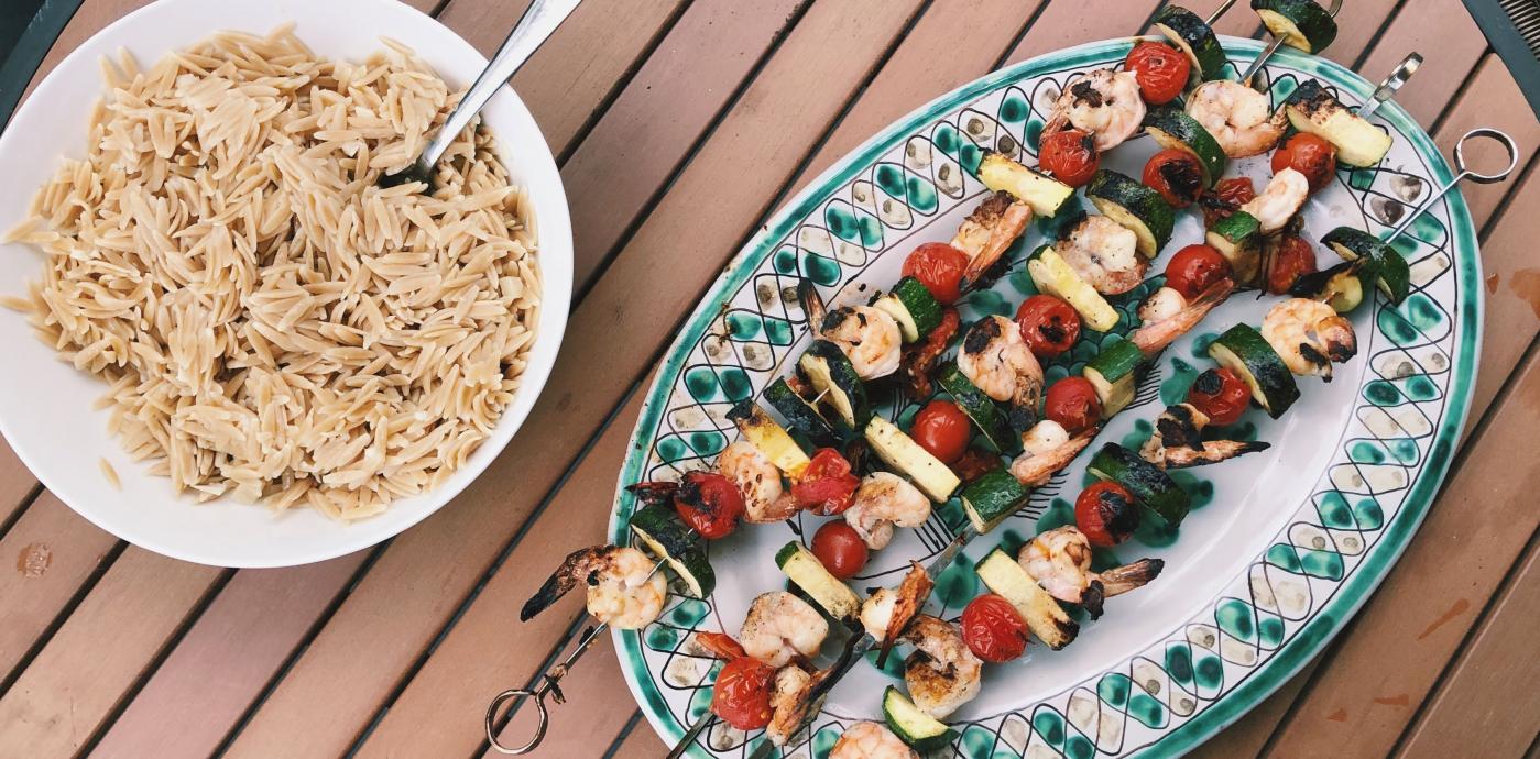 grilled shrimp and vegetable skewers served with whole grain orzo