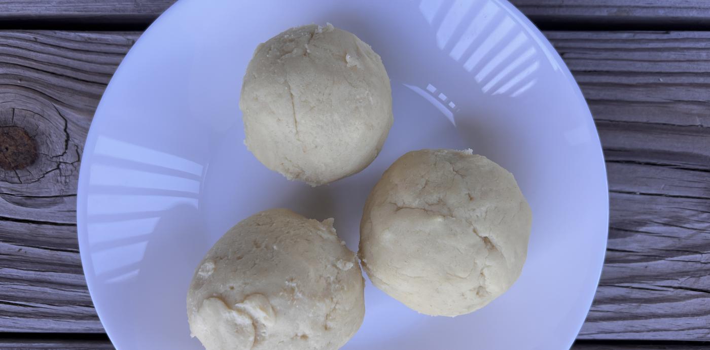 balls of dough on a white dish