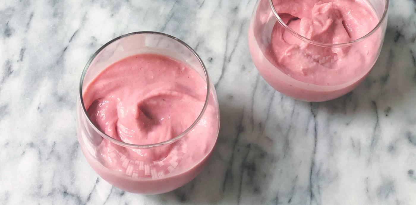 strawberry soft serve ice cream in 2 glasses