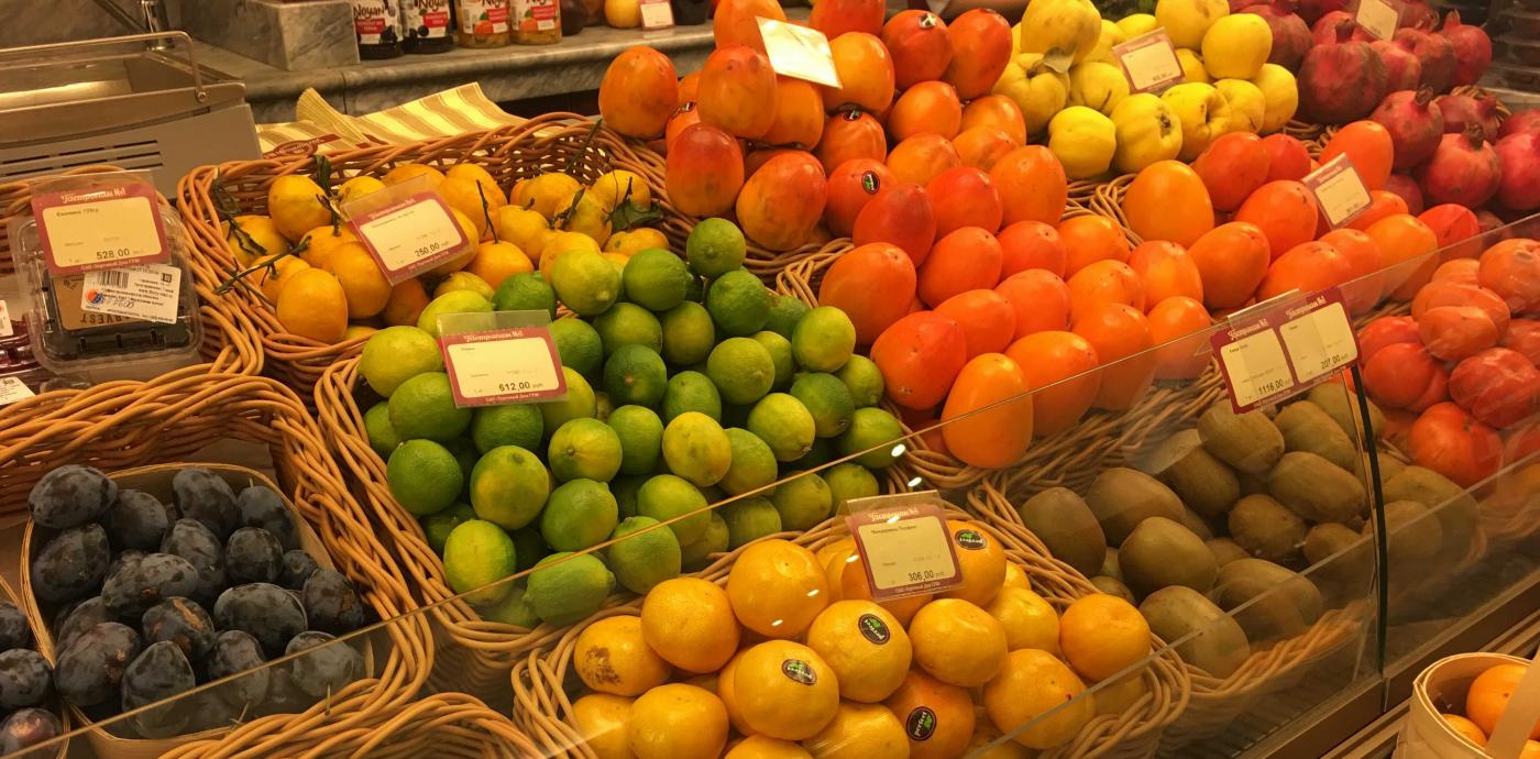 Variety of colorful citrus fruits at a market