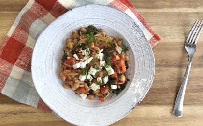 a bowl of orzo pasta and veggies in a white bowl