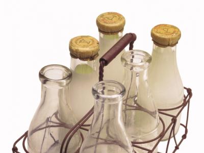 Glass milk bottles in wire carrier