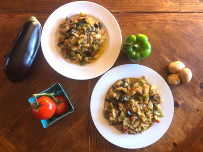 ciaki chukka in dish with potatoes, eggplant, peppers, tomatoes