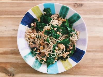 stir fried whole grain noodles with kale, mushrooms, and tempeh