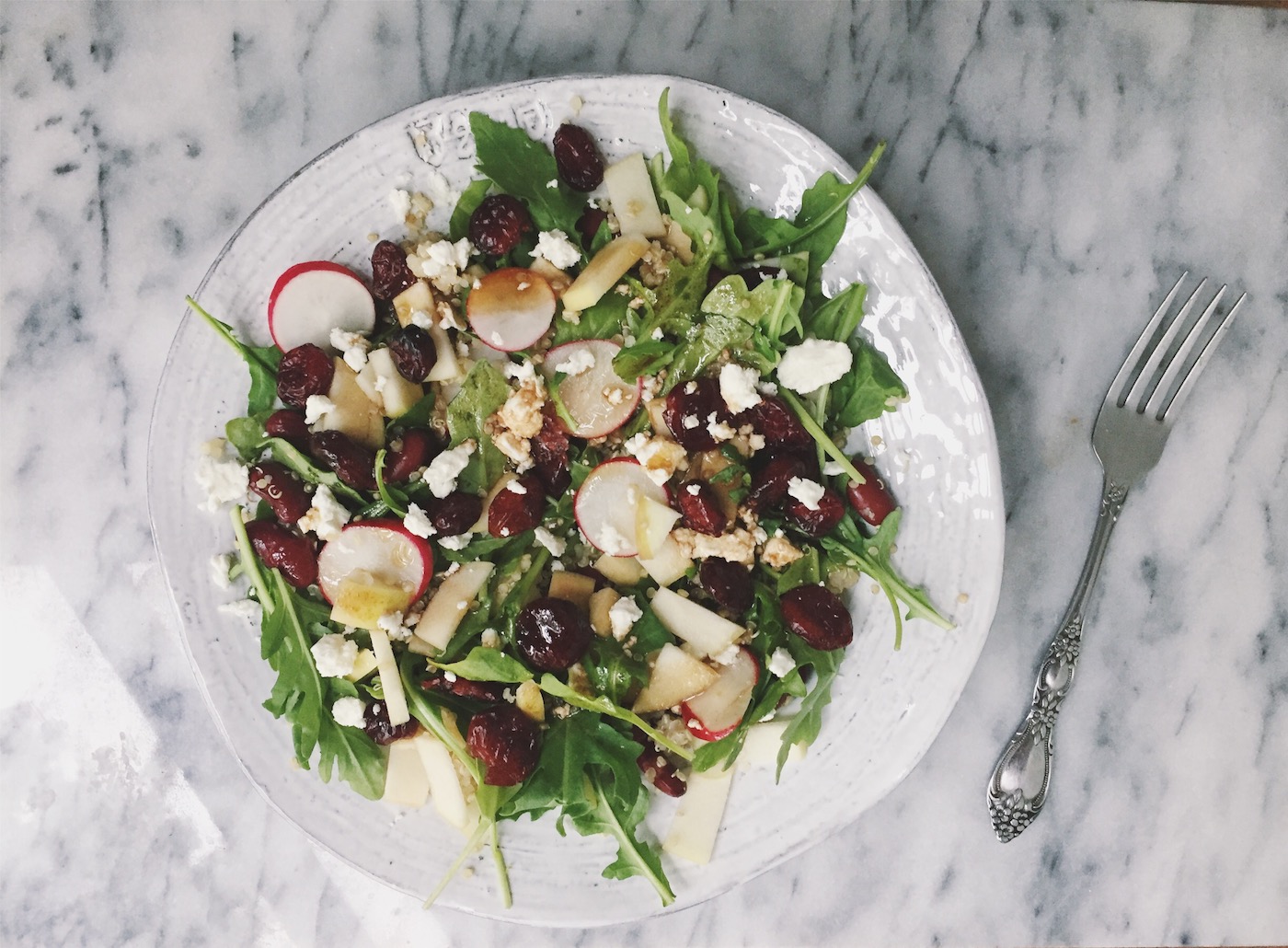 quinoa salad with cranberries, arugula, radishes, goat cheese, and kidney beans