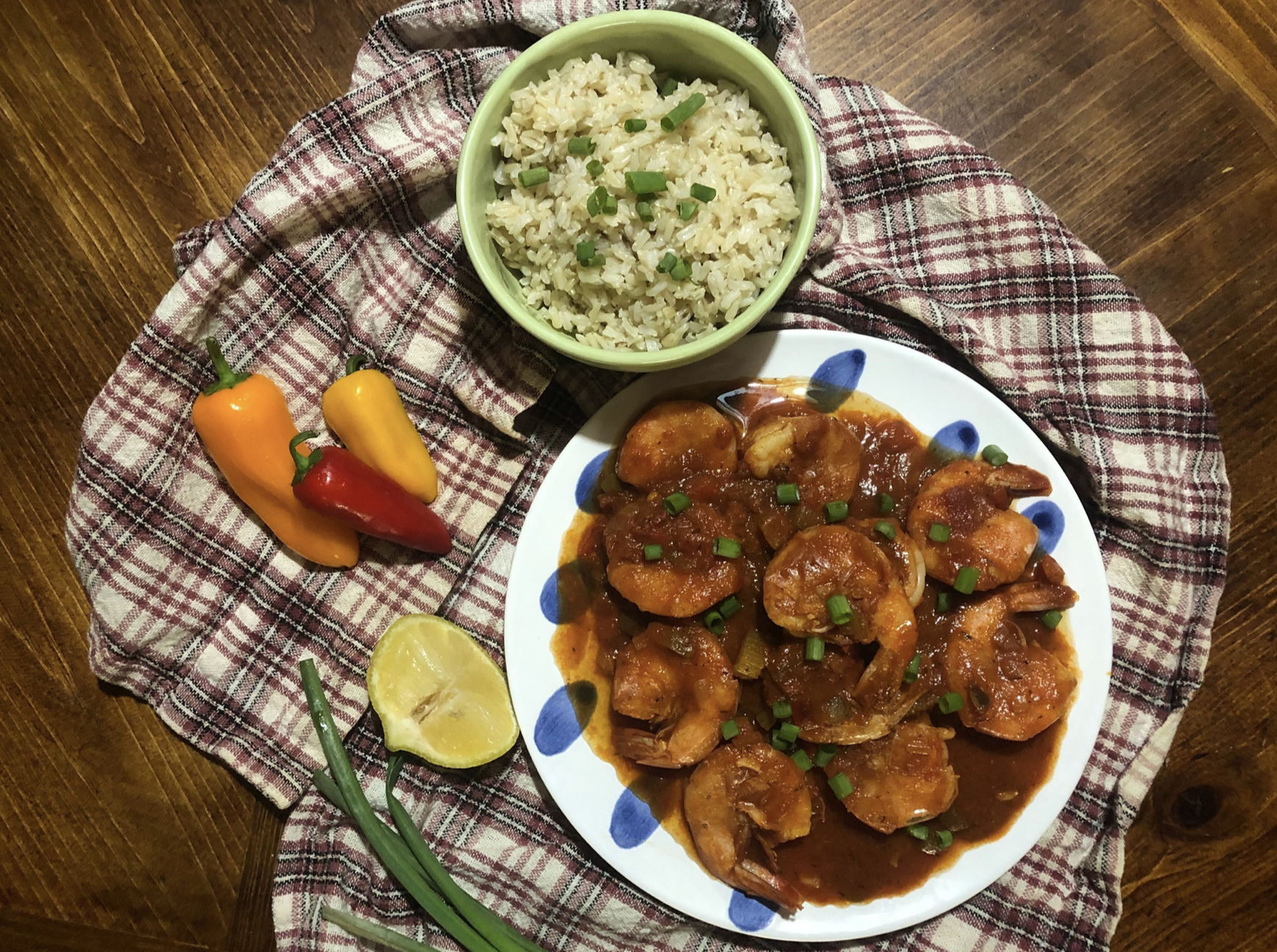 shrimp creole with rice and peppers on printed napkin