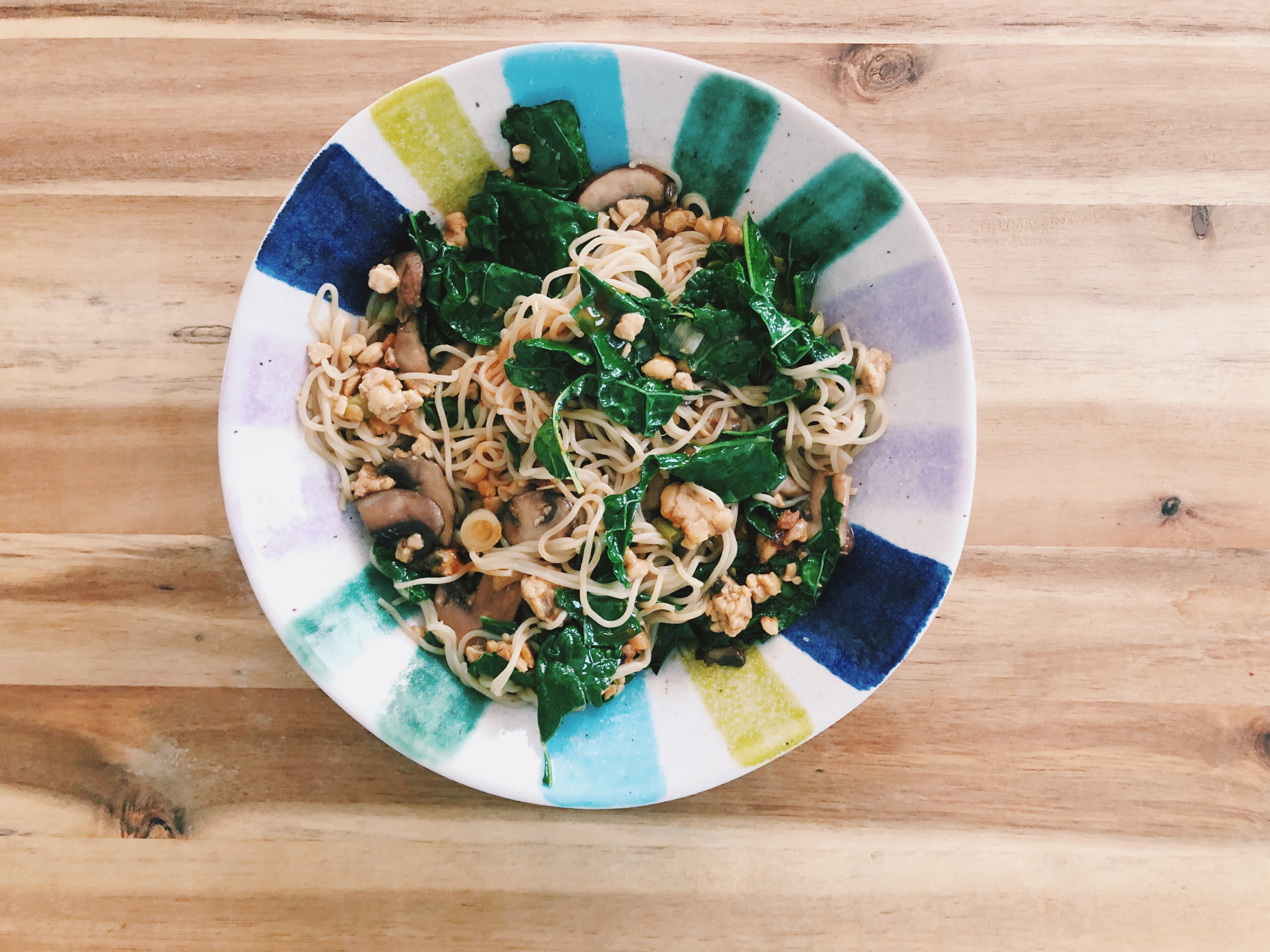stir fried whole grain noodles with kale, mushrooms, and tempeh