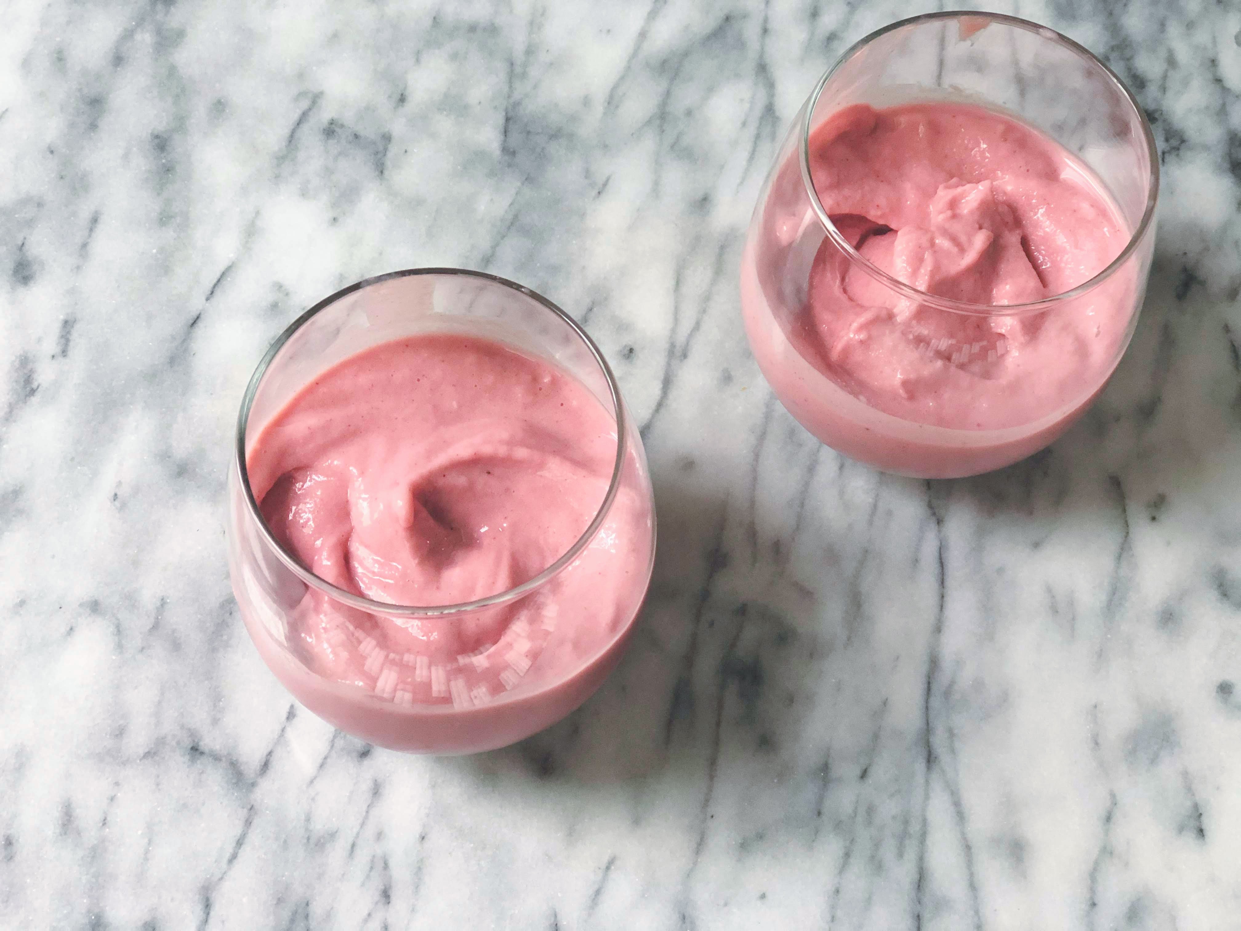 strawberry soft serve ice cream in 2 glasses