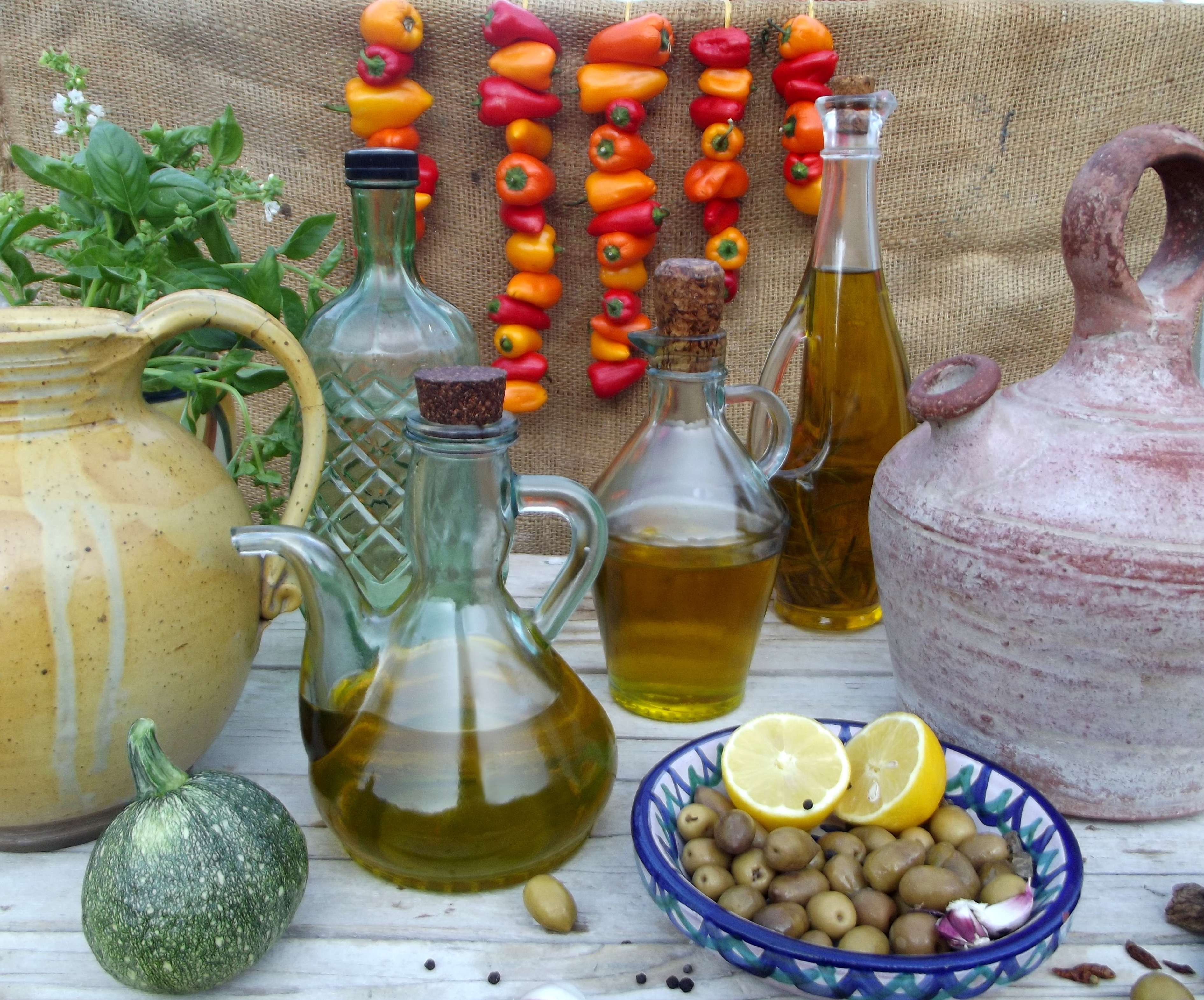 olive oil, olives and hanging vegetables 