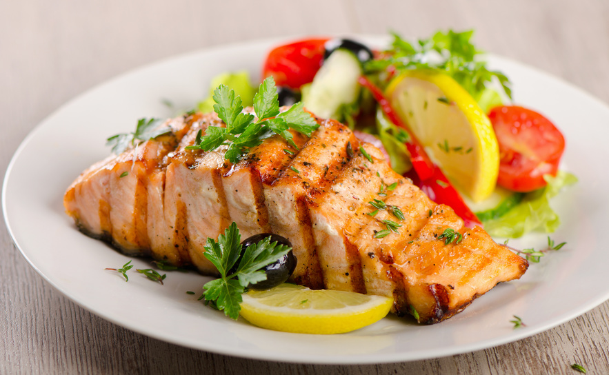 Plate with grilled salmon and salad