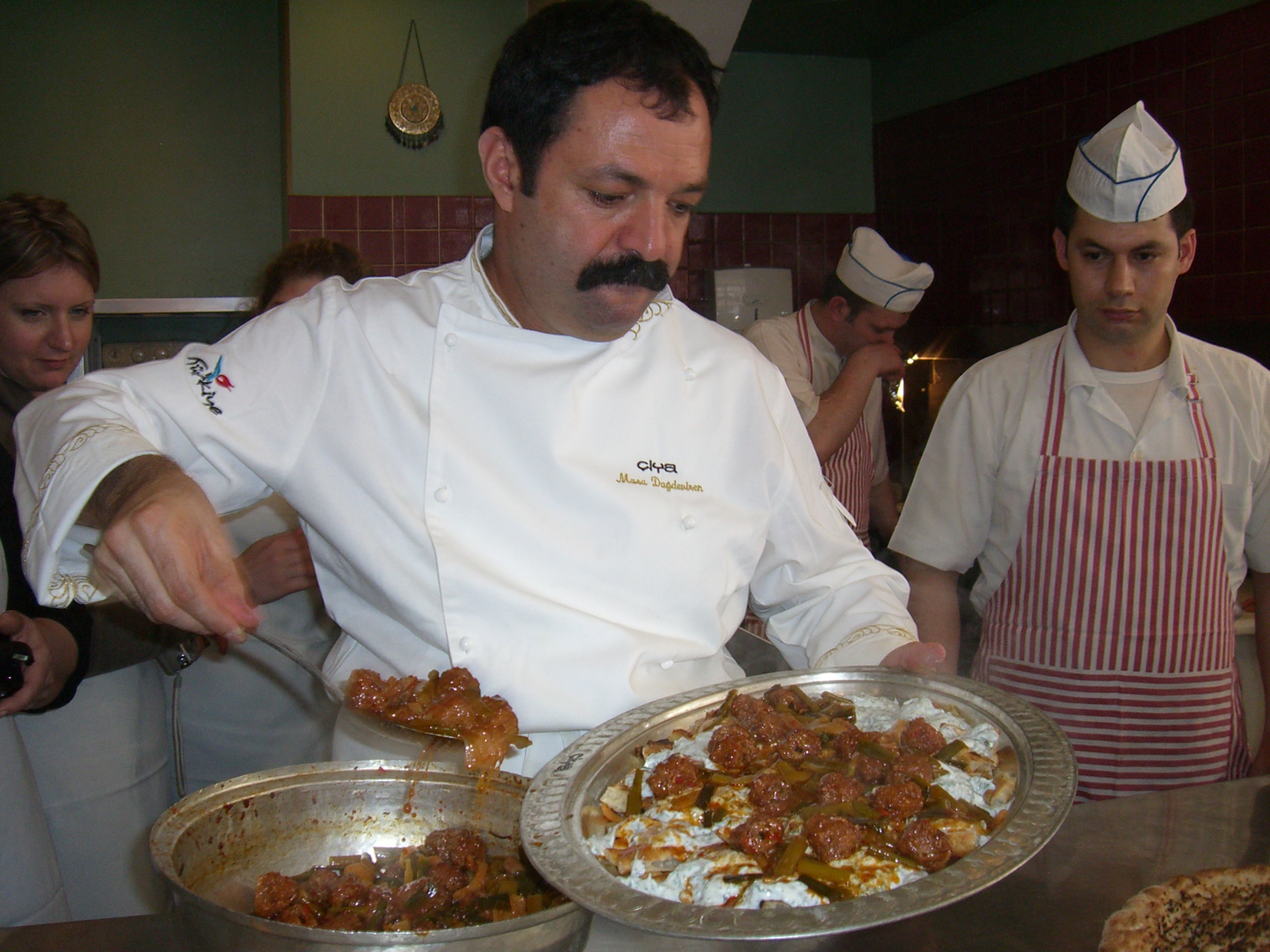 Chef Musa Dagdeviren cooks during an Oldways tour