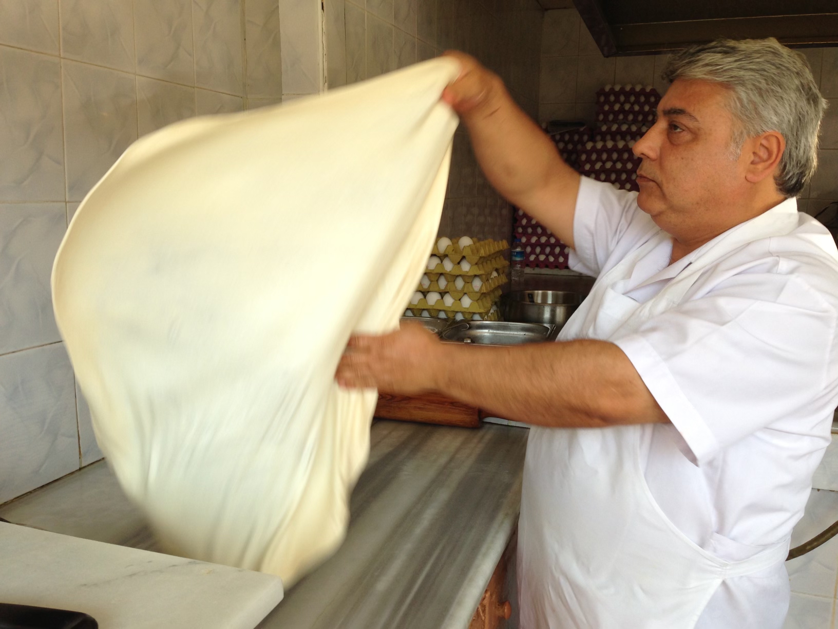 man prepares street food in turkey