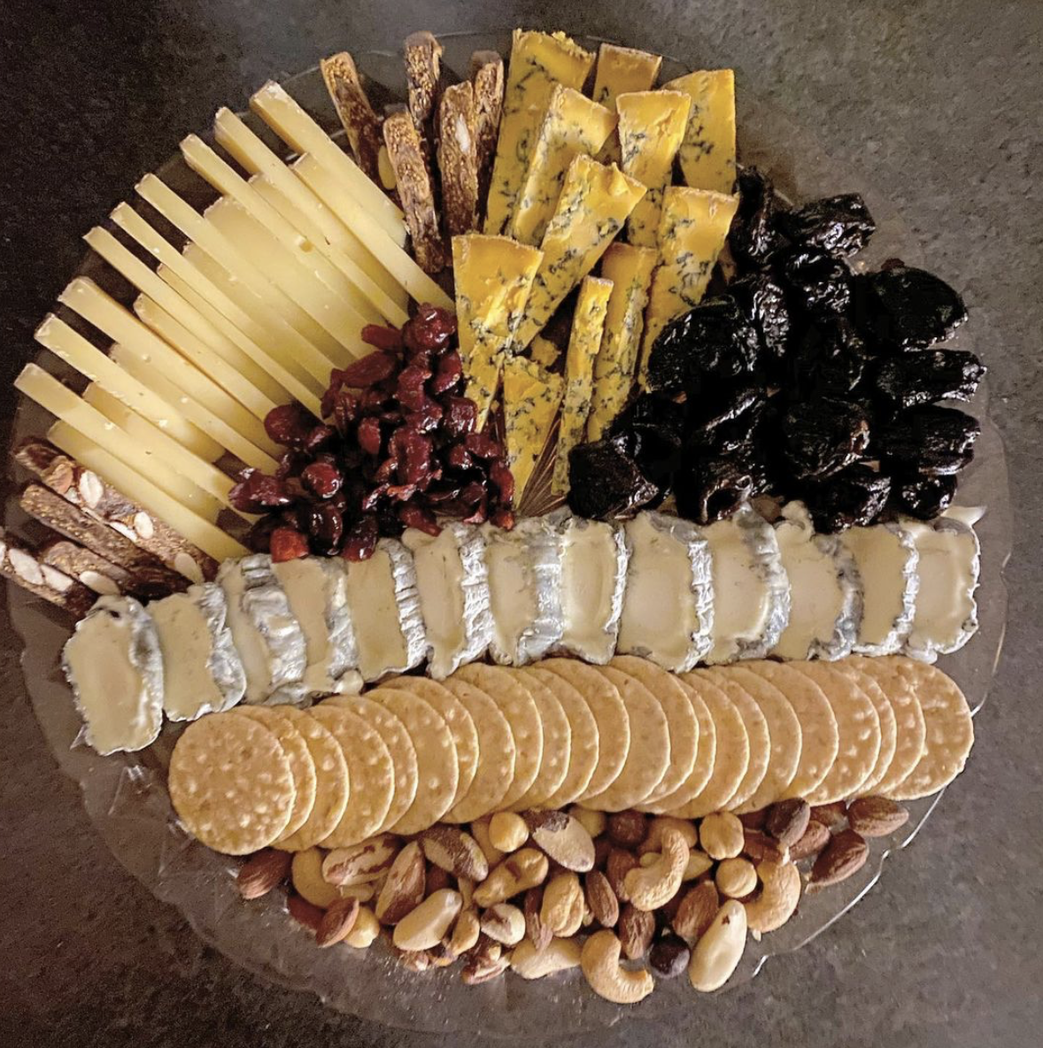 cheese board with fruit and nuts