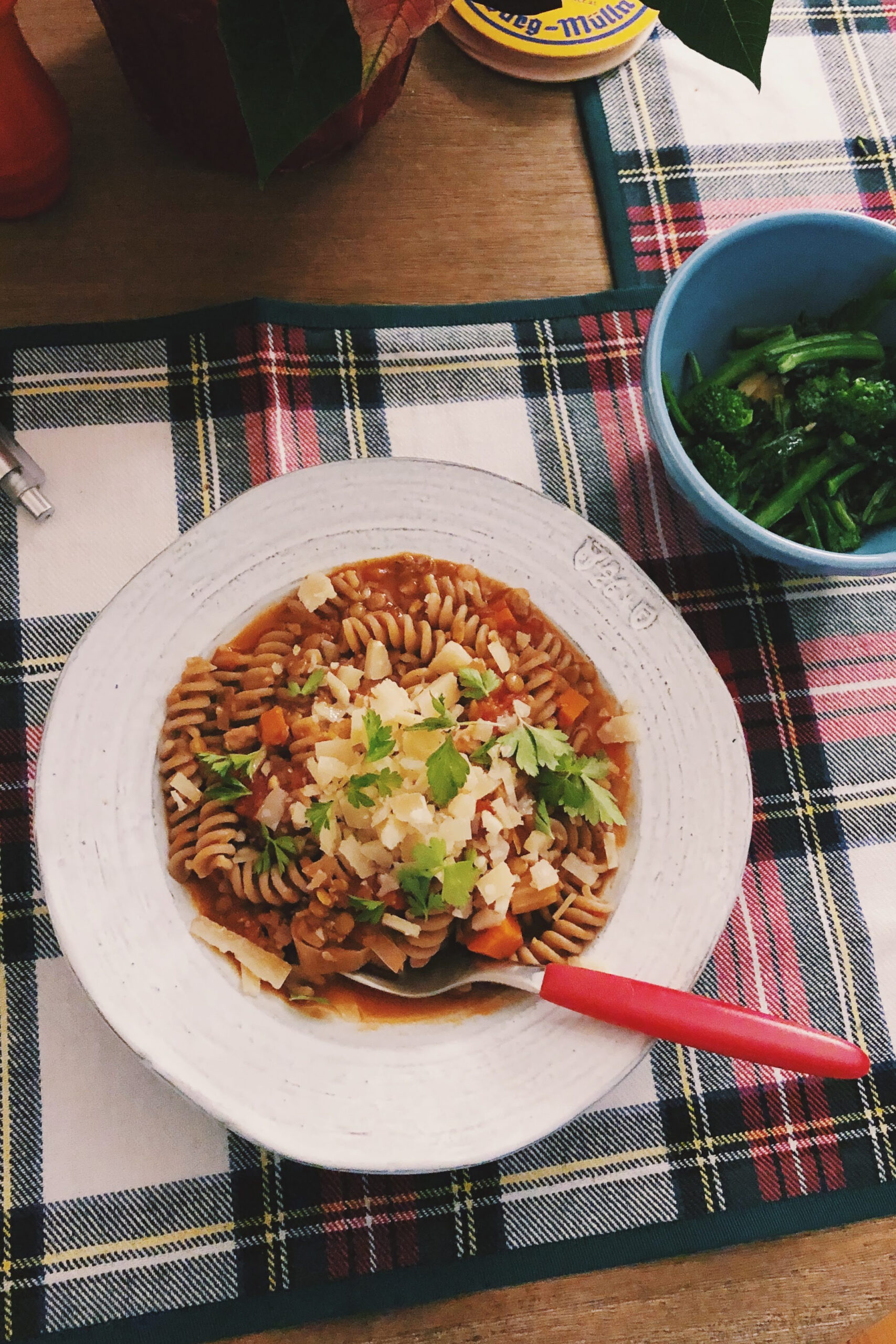 pasta bolognese on a plaid placemat