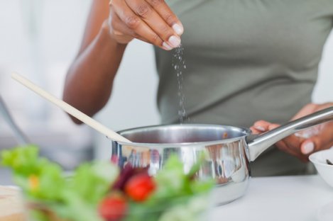 Woman Salting Pot