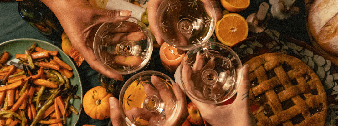 A table laden with an array of plates filled with food and various drinks