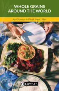 "Whole Grains Around the World" menu plan book featuring a colorful grain dish with beets and greens.