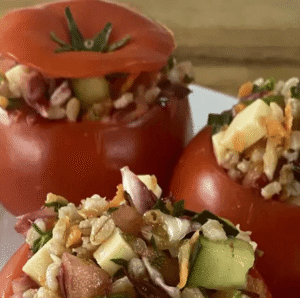 Colorful tomatoes stuffed with a salad mixture of vegetables