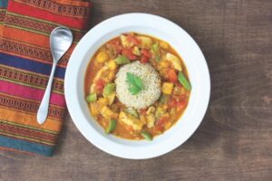 Delicious chicken curry in a bowl, paired with a serving of white rice