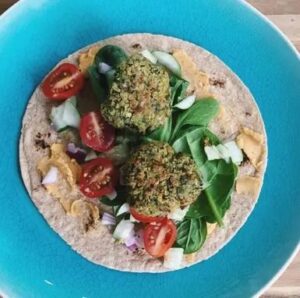 Healthy vegan wrap with falafel and vegetables